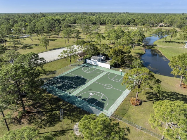 view of basketball court featuring a water view