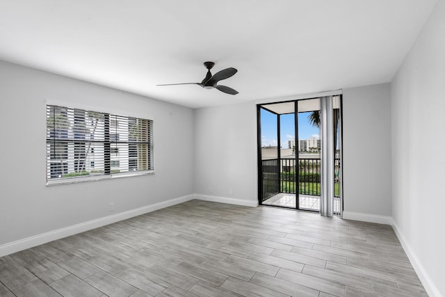 unfurnished room with ceiling fan