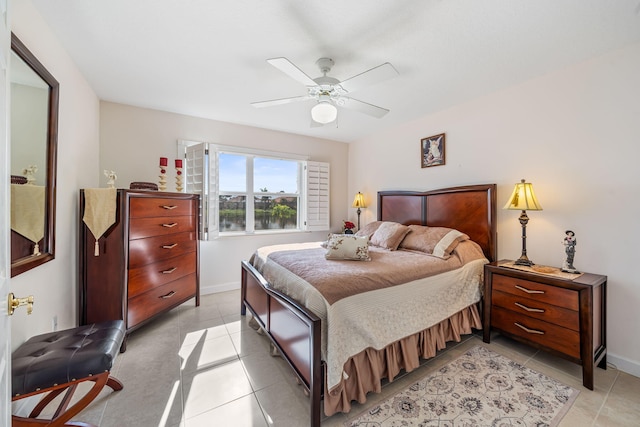 tiled bedroom with ceiling fan