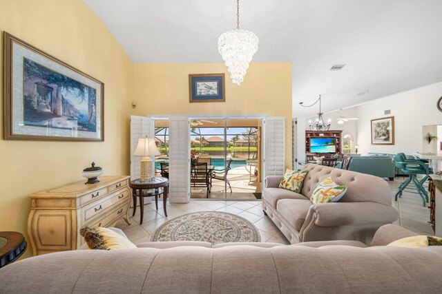 tiled living room featuring a chandelier and vaulted ceiling