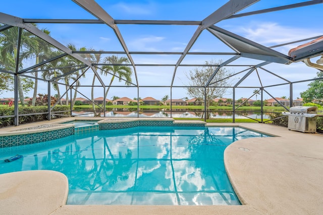 view of swimming pool featuring glass enclosure, a water view, an in ground hot tub, area for grilling, and a patio