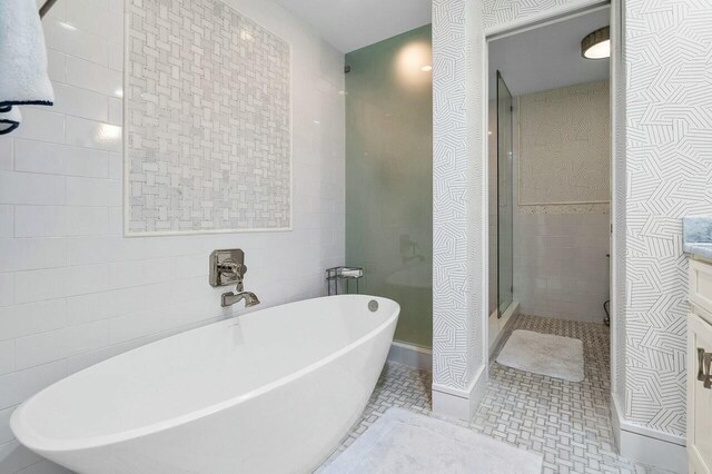 bathroom featuring a shower with shower door