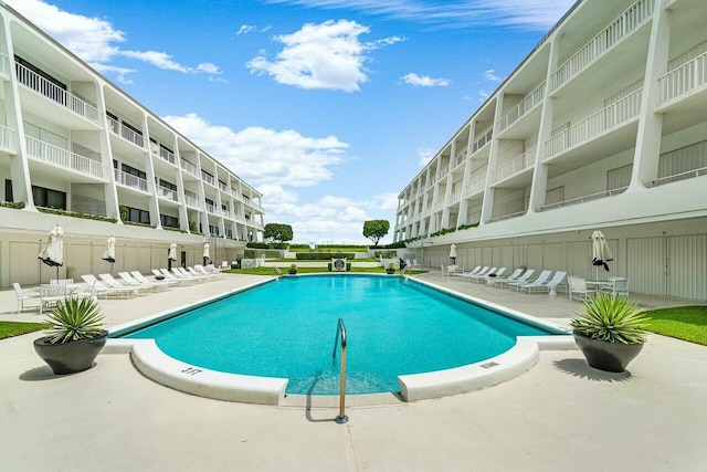 view of swimming pool featuring a patio area