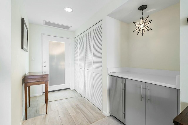 hallway featuring light hardwood / wood-style floors