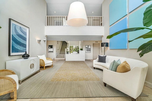 living room with a towering ceiling