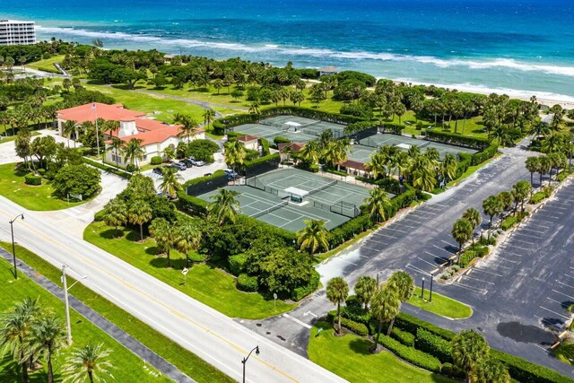 birds eye view of property featuring a view of the beach and a water view