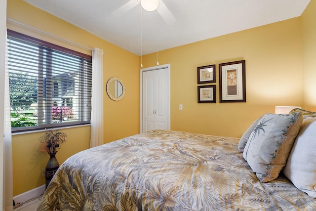 bedroom featuring a closet and ceiling fan