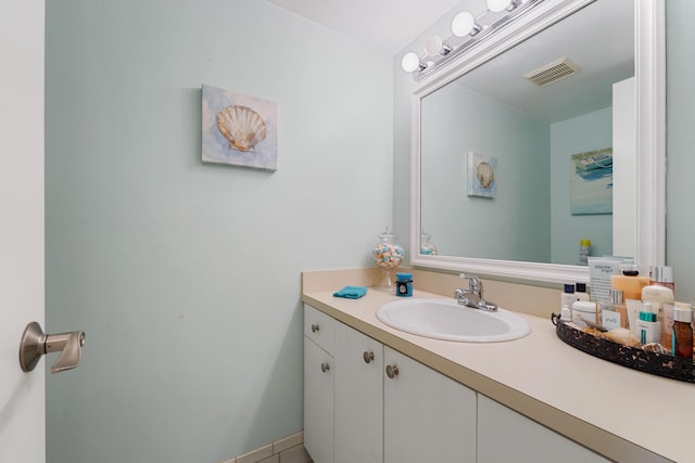 bathroom featuring tile patterned floors and vanity