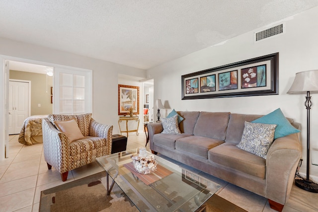 tiled living room with a textured ceiling