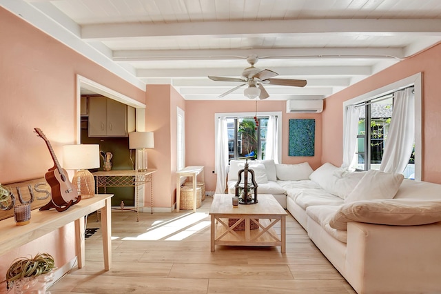 living room featuring beamed ceiling, ceiling fan, light wood-type flooring, and an AC wall unit