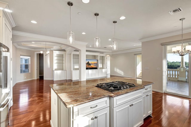 kitchen featuring black gas cooktop, white cabinets, and ornamental molding