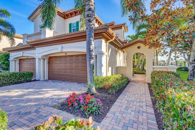 mediterranean / spanish house with a garage