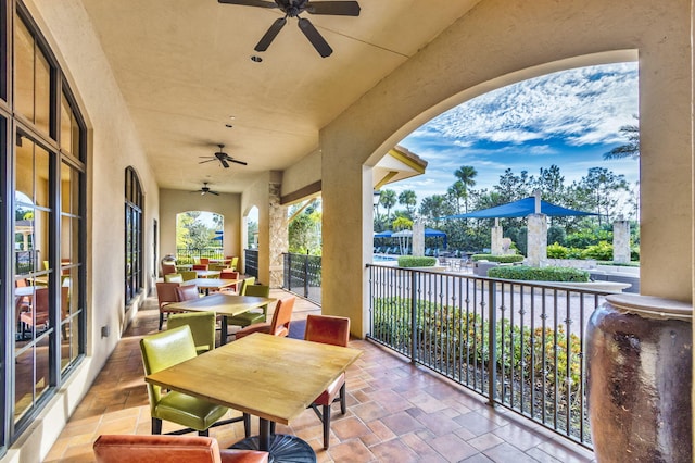 view of patio / terrace featuring ceiling fan