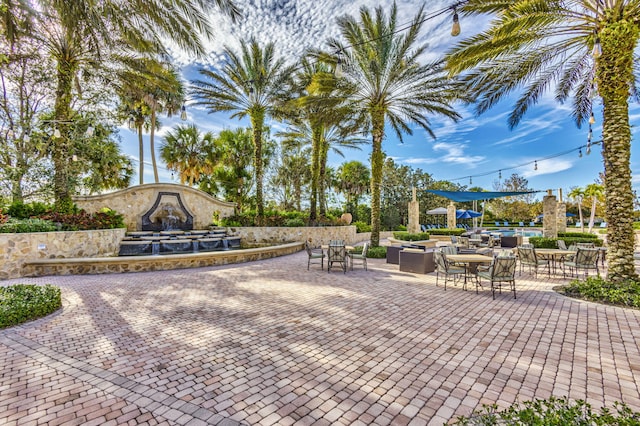 view of property's community with a patio