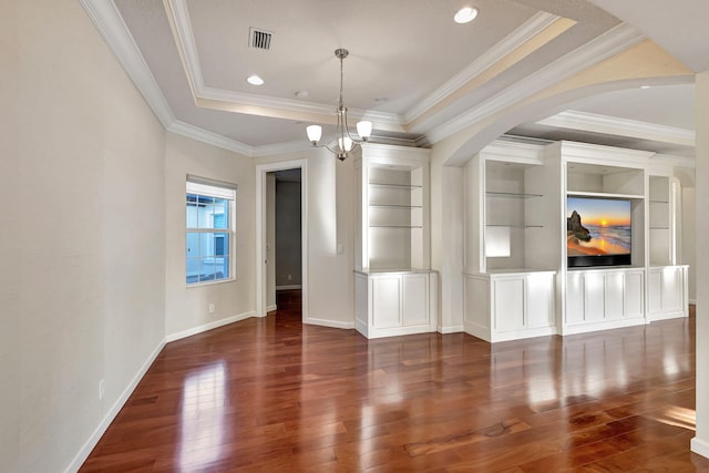 unfurnished living room featuring dark wood-type flooring, built in features, and a chandelier