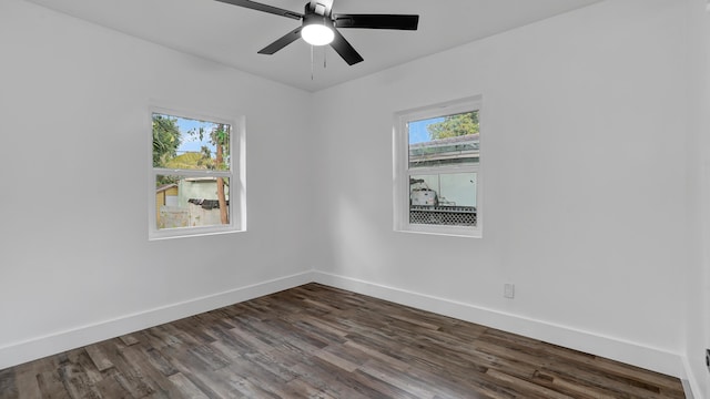 empty room featuring dark hardwood / wood-style floors and ceiling fan