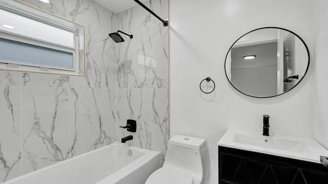 full bathroom with vanity, tiled shower / bath combo, and toilet