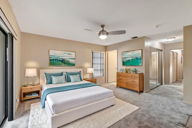 bedroom with light colored carpet and ceiling fan