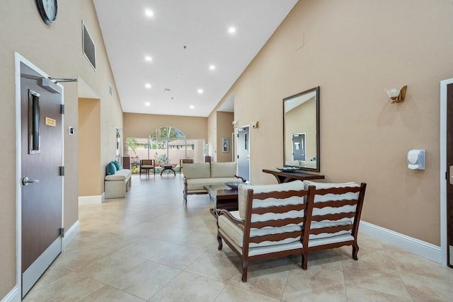 living room with a high ceiling