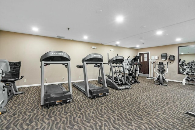 exercise room with dark carpet