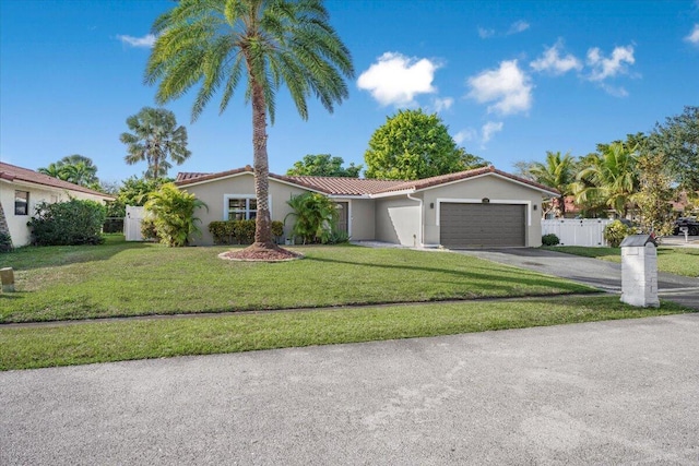 view of front of home with a garage and a front yard