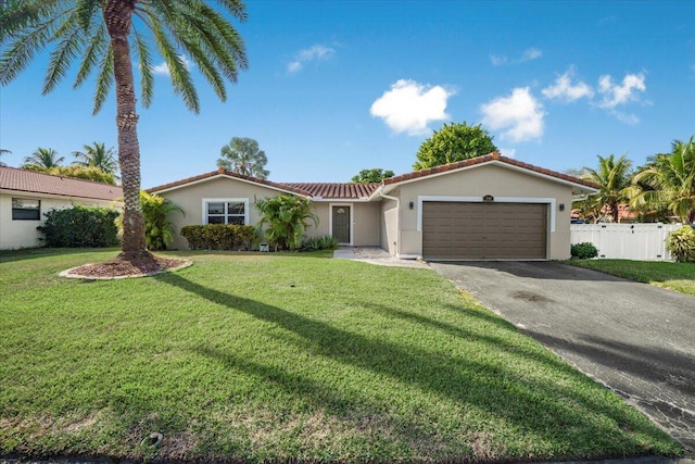 view of front facade with a front yard and a garage