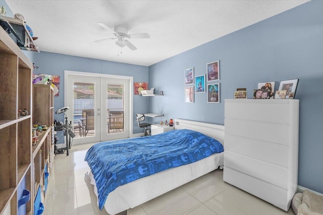 bedroom featuring access to outside, ceiling fan, french doors, and a textured ceiling