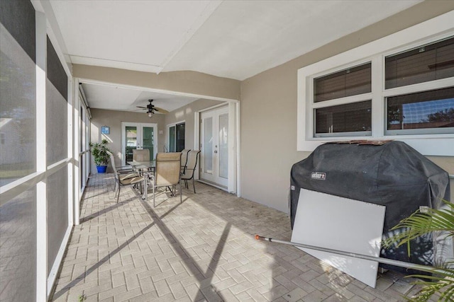 unfurnished sunroom with french doors and ceiling fan