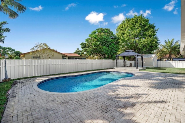 view of swimming pool featuring a gazebo and a patio area