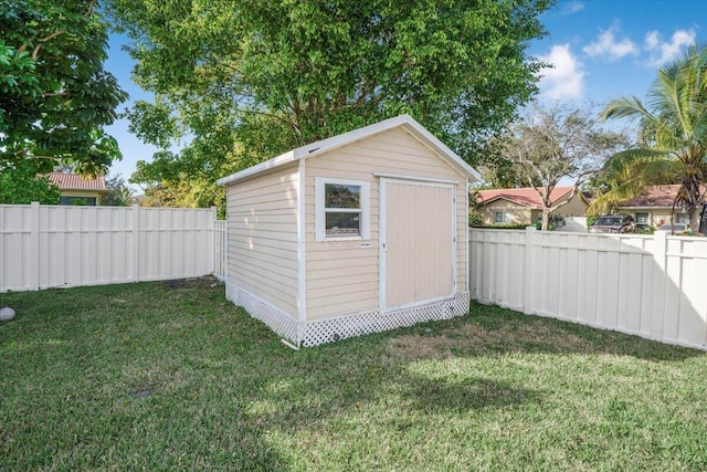 view of outbuilding with a lawn