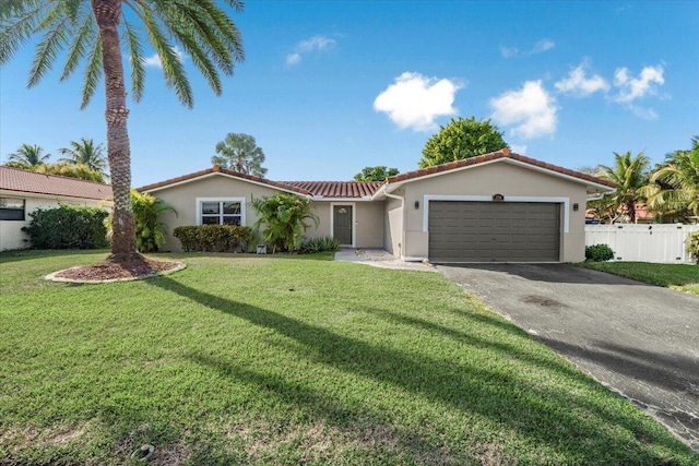 view of front of house with a garage and a front yard