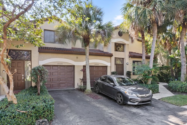 mediterranean / spanish-style home featuring a garage