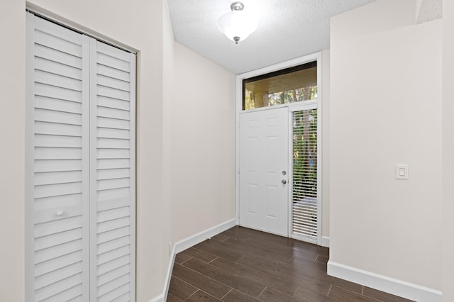 entryway with a textured ceiling