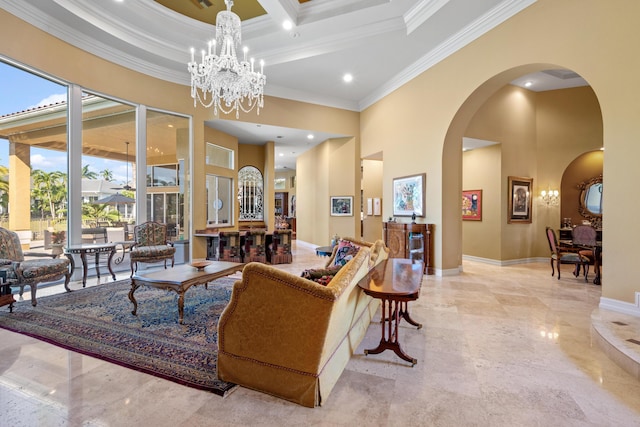 living room with crown molding, a towering ceiling, and a chandelier