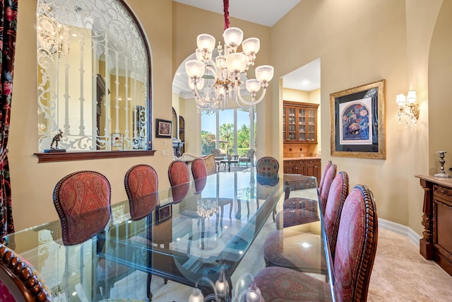 dining space featuring a notable chandelier