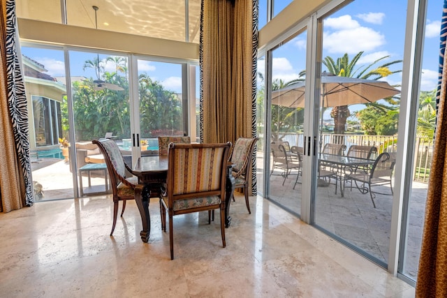 dining room with plenty of natural light and french doors