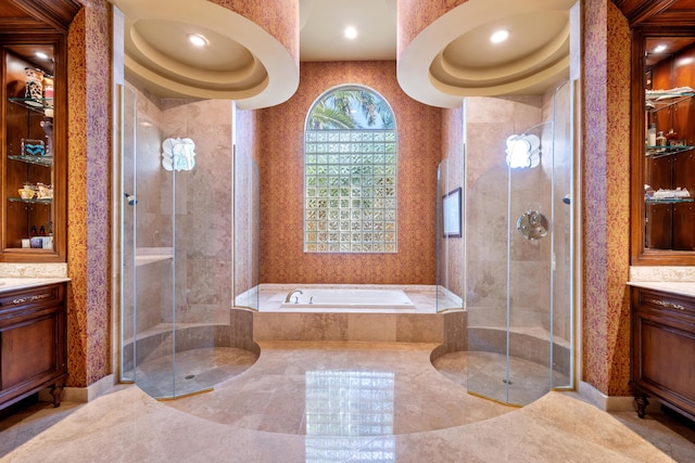 bathroom with separate shower and tub and vanity