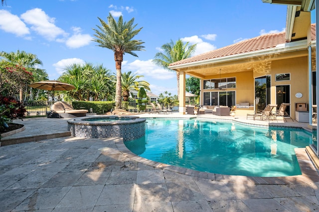 view of swimming pool with an in ground hot tub, a patio, and an outdoor hangout area