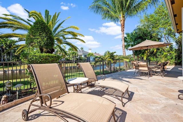 view of patio with a water view