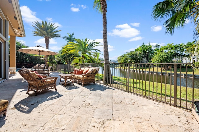 view of patio featuring a water view and an outdoor hangout area