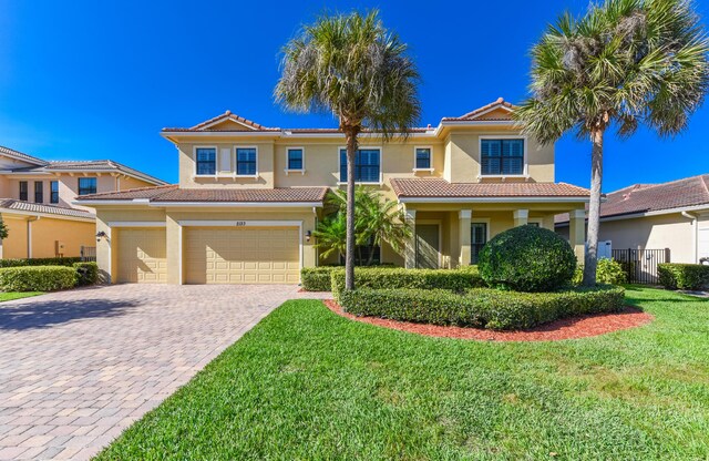 view of front facade featuring a front yard and a garage