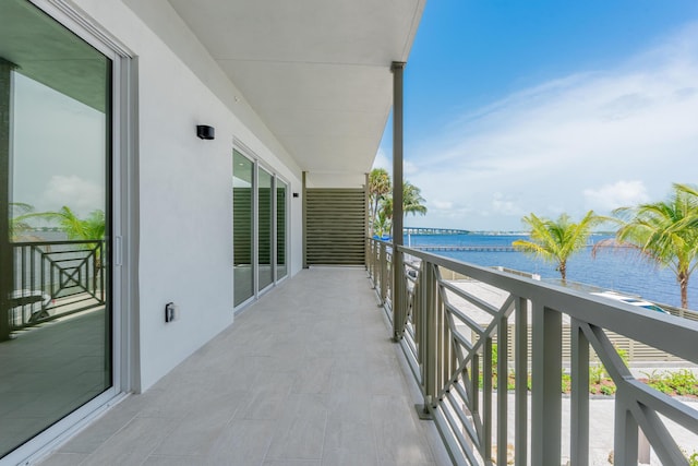 balcony featuring a water view