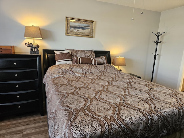 bedroom featuring hardwood / wood-style flooring