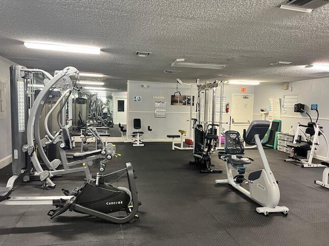 workout area featuring a textured ceiling