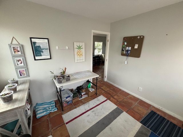 office area with dark tile patterned flooring