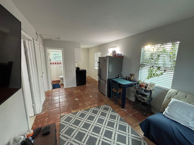 living room with dark tile patterned flooring