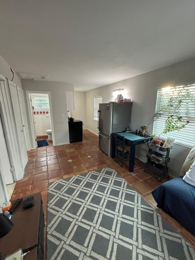 living room featuring dark tile patterned flooring