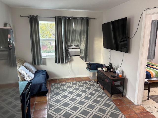 living area with dark tile patterned floors