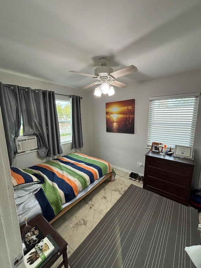 bedroom featuring multiple windows, ceiling fan, and cooling unit