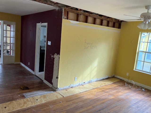 unfurnished room featuring hardwood / wood-style flooring and ceiling fan